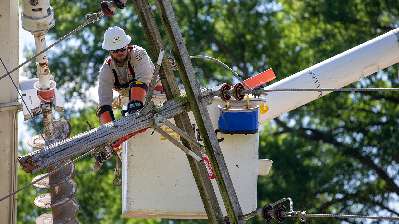 Contractors restore power in Winona, Mississippi on Tuesday, April 14, 2020.